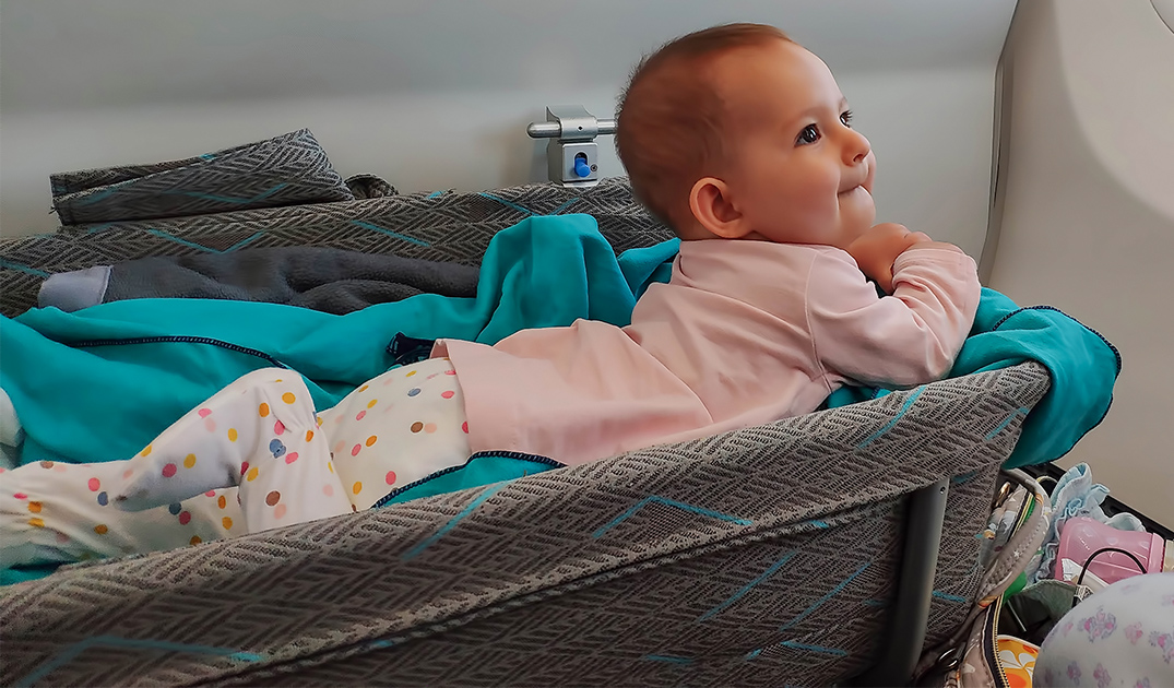 baby in portable bed