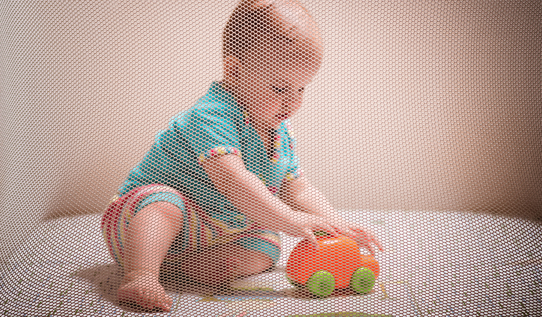 baby playing in Graco Pack 'n Play