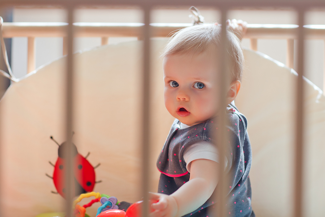 baby playing in playpen